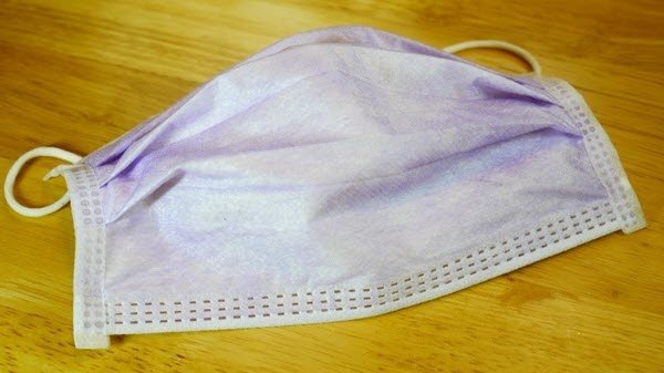 Disposable surgical mask on a clean surface